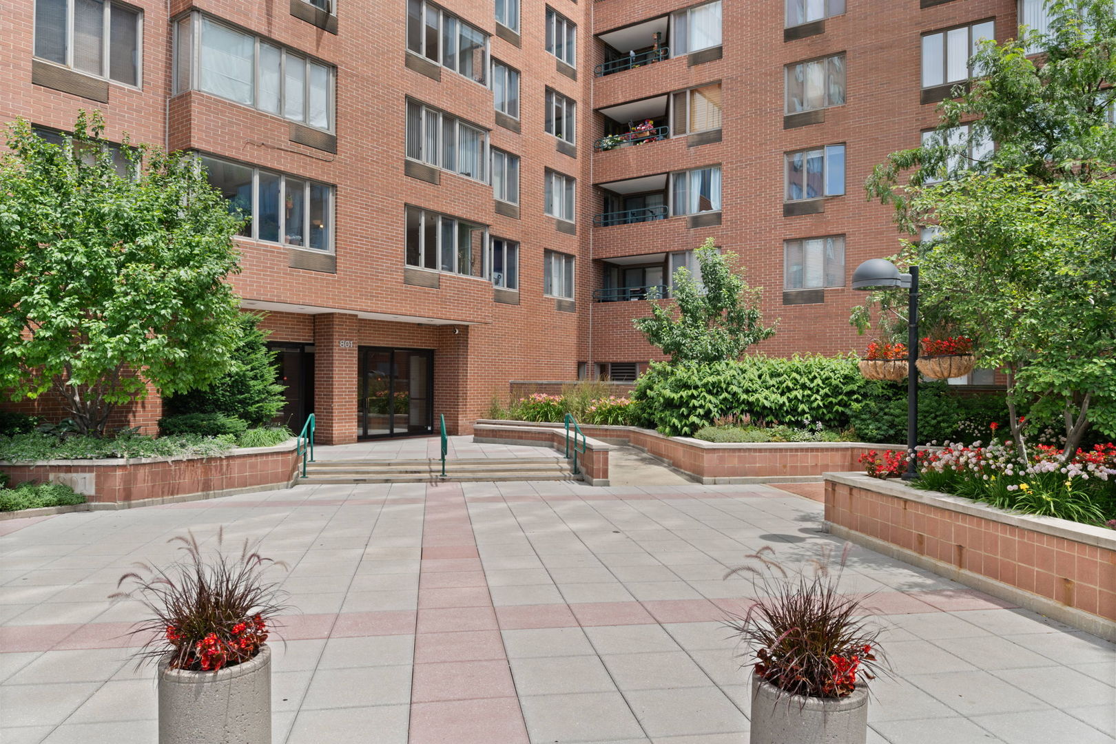 a view of a building with potted plants