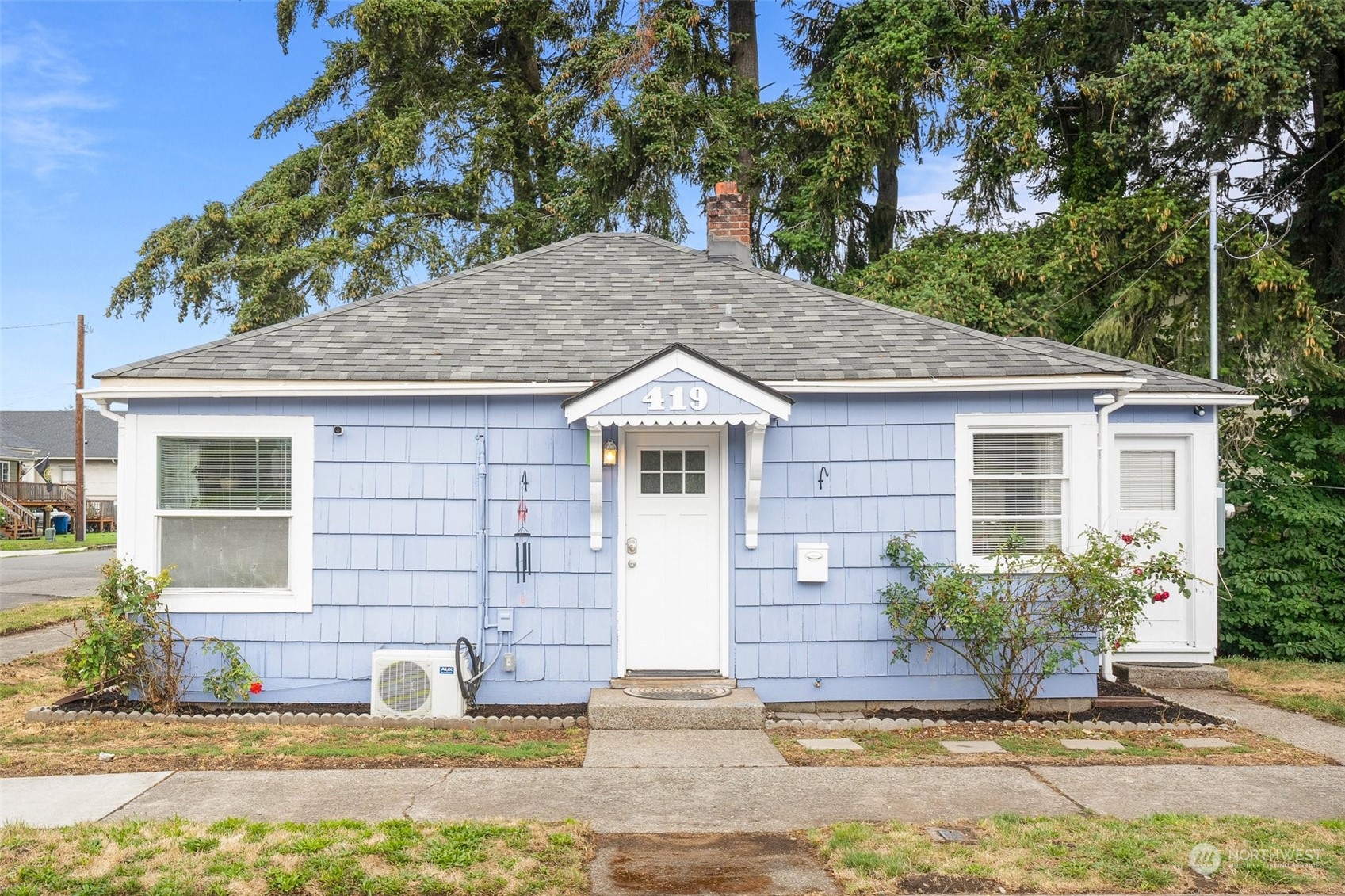 a house with trees in the background