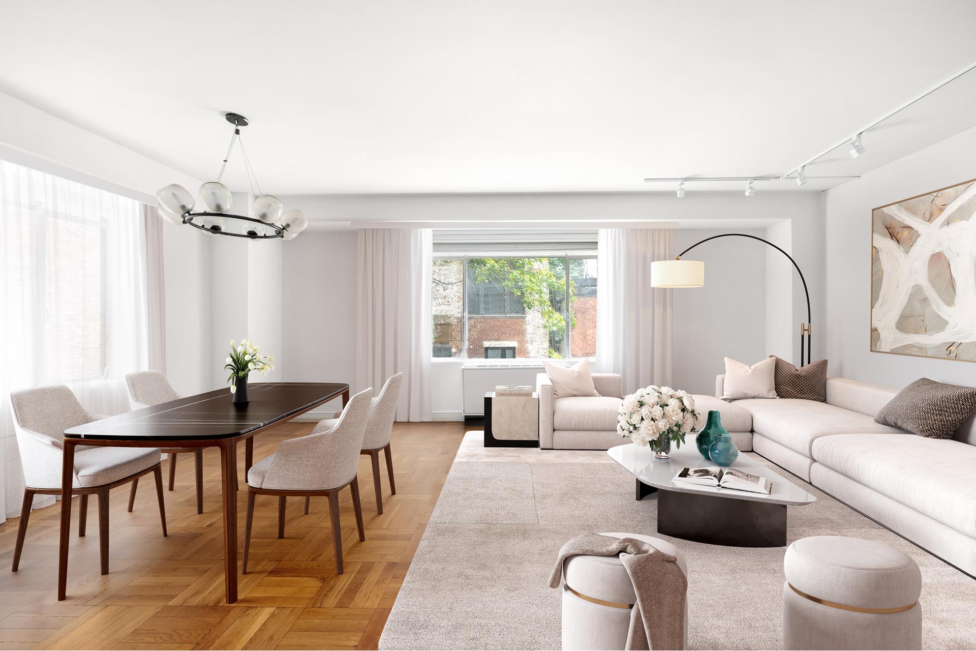 a living room with furniture a chandelier and a window