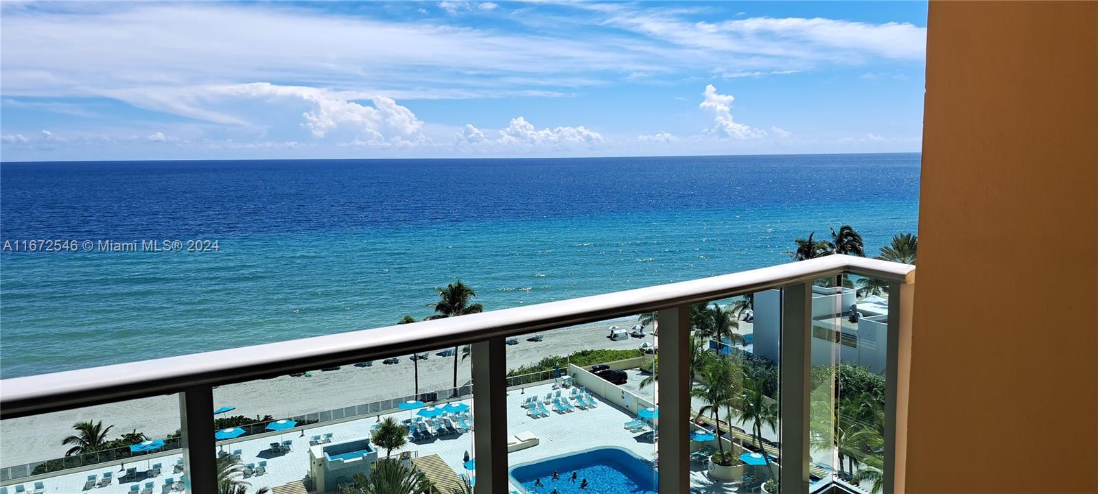 a view of a balcony with an ocean view