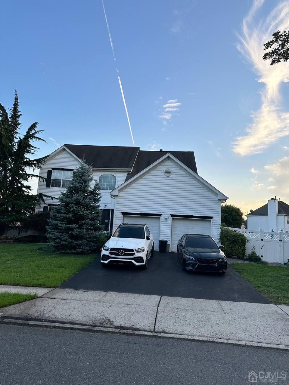 a car parked in front of a house