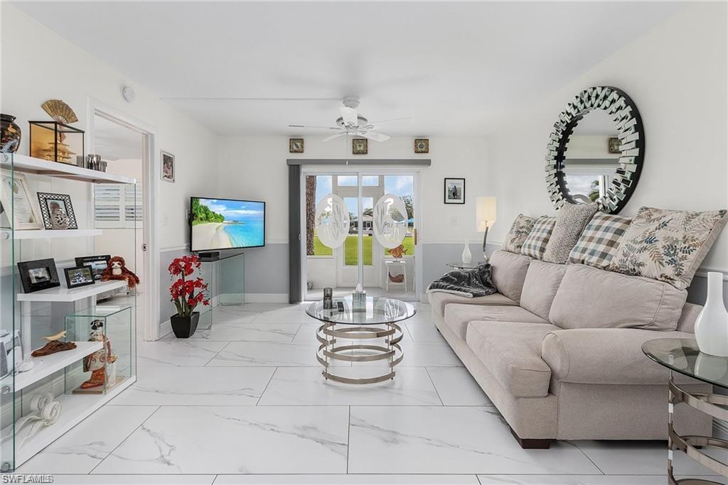 Tiled living room with ceiling fan