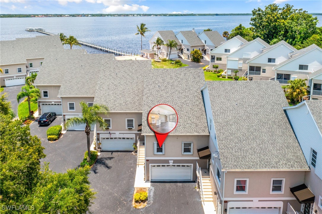 an aerial view of a house with swimming pool