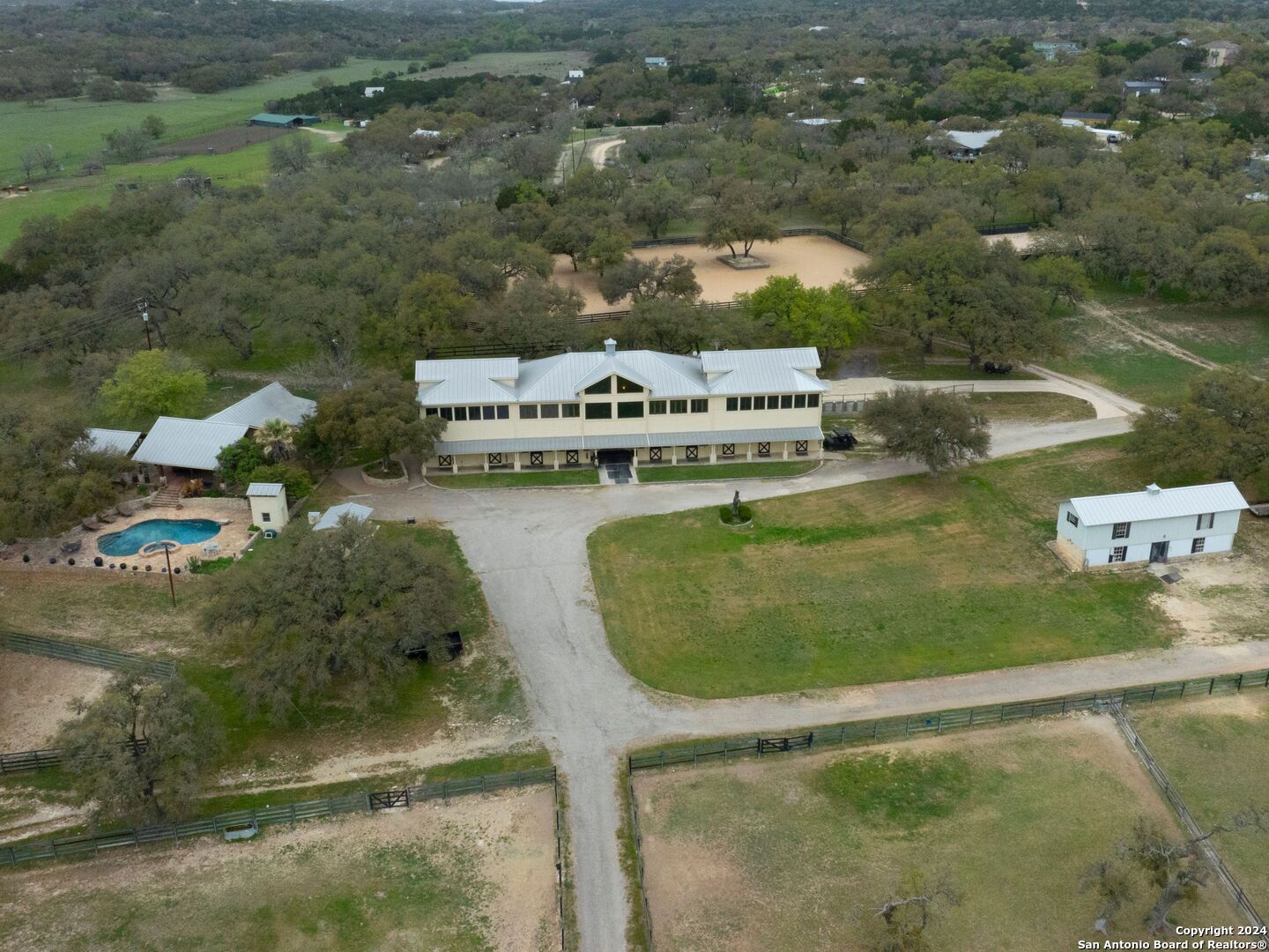 an aerial view of a house with swimming pool