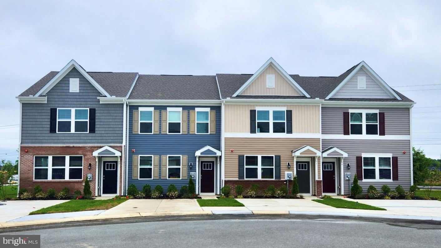 front view of a house next to a yard