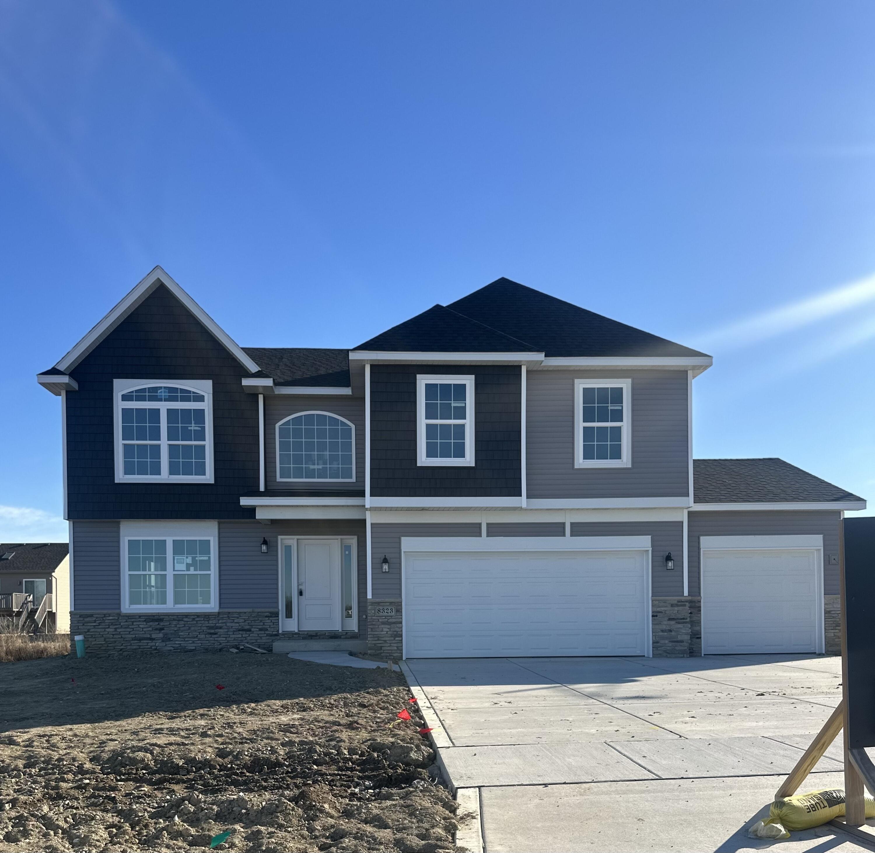 a front view of a house with yard