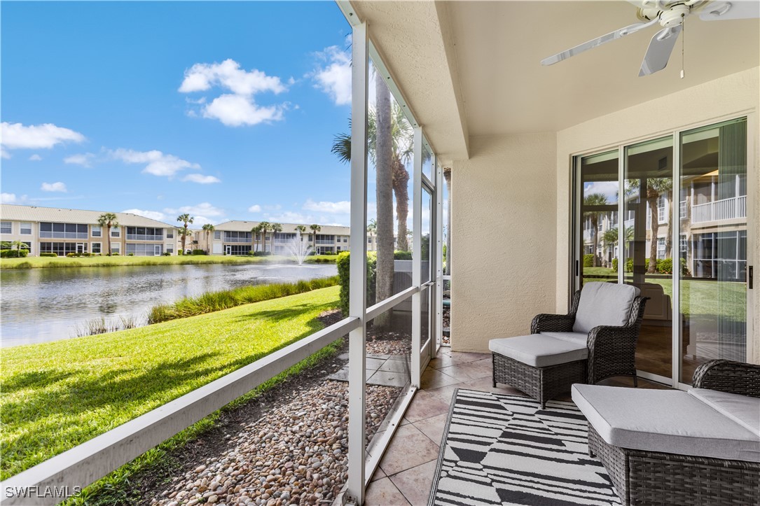 a view of a balcony with lake view and a floor to ceiling window