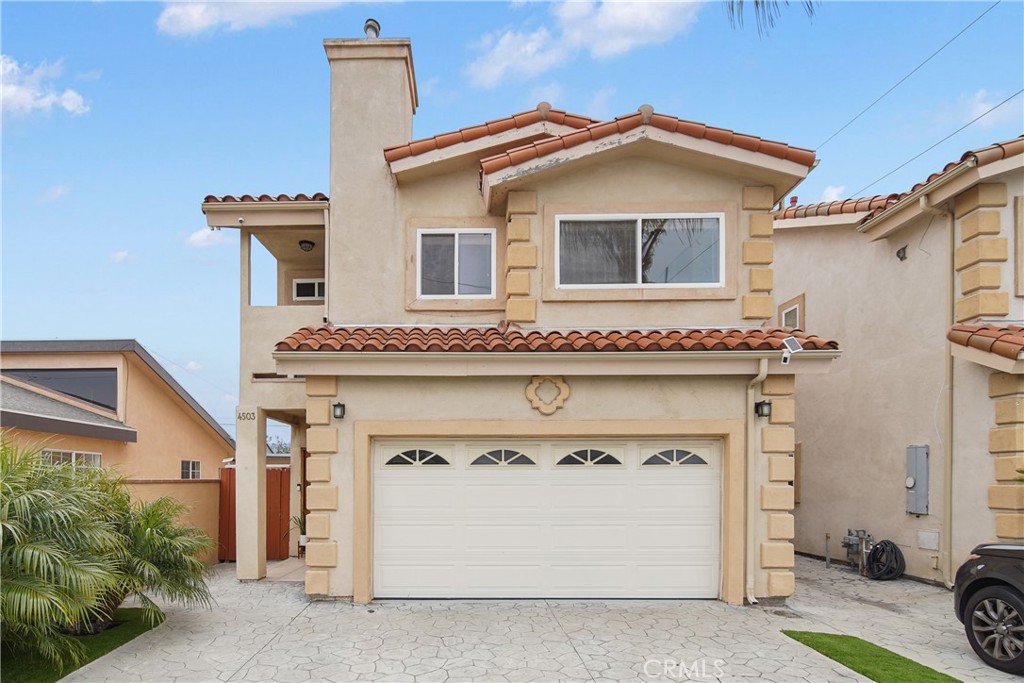 a front view of a house with garage