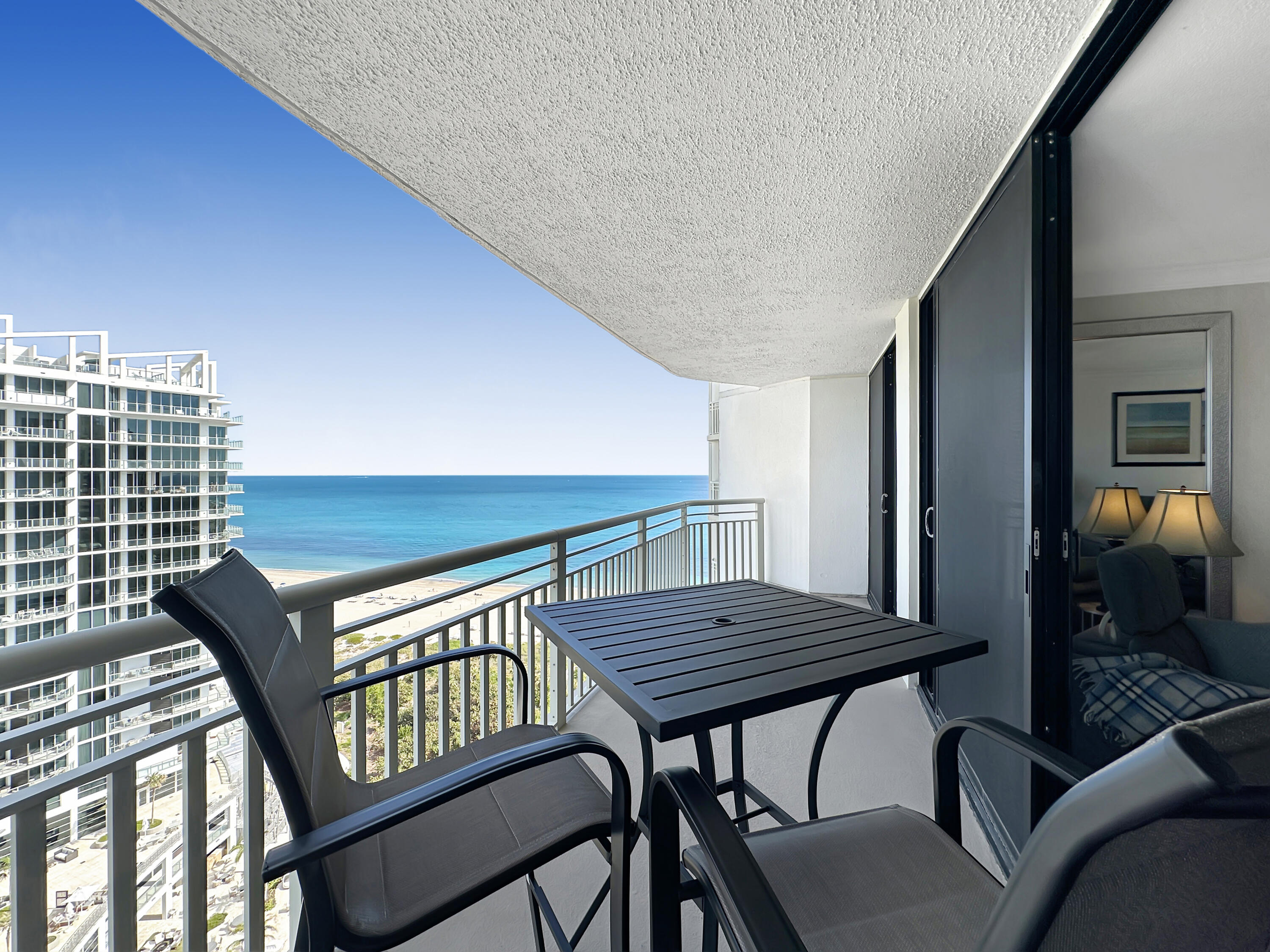 a view of a balcony with furniture