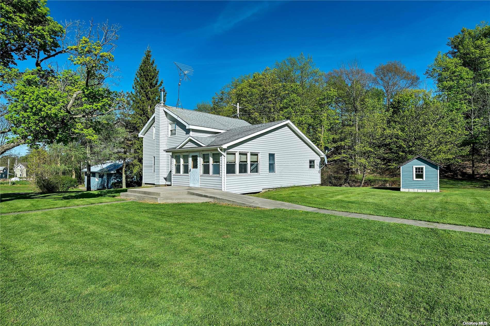 a view of a house with a big yard