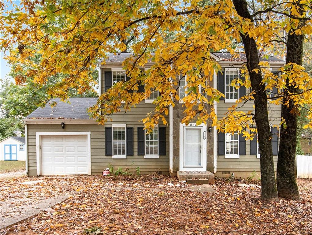 front view of a house with a trees