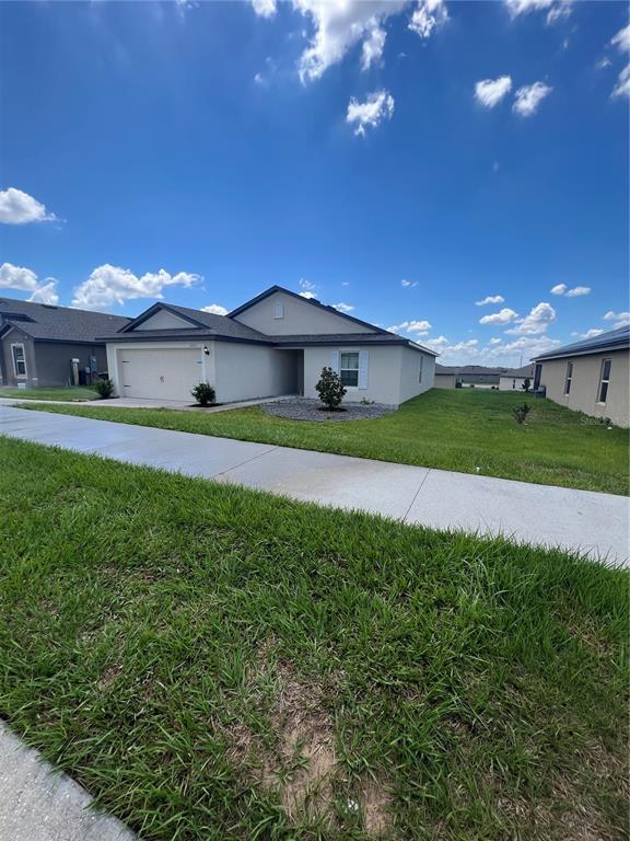 a view of a house with a big yard