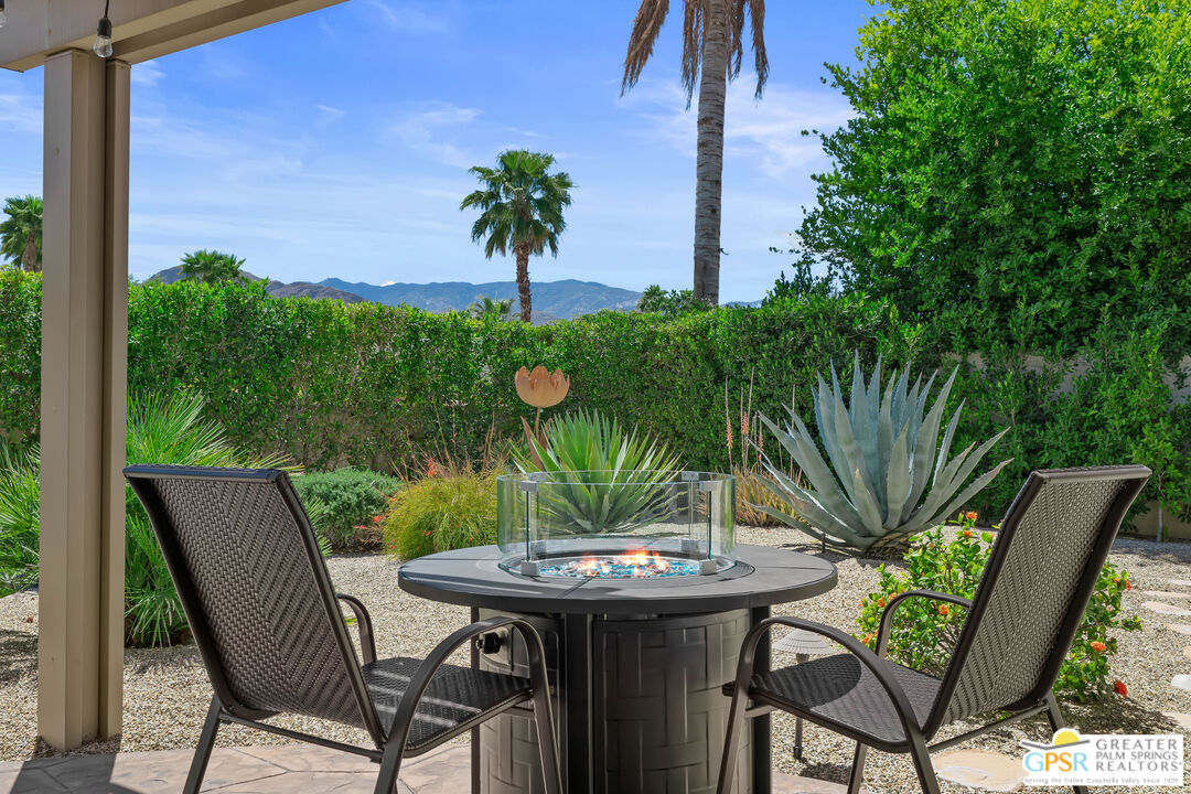 a view of a backyard with furniture