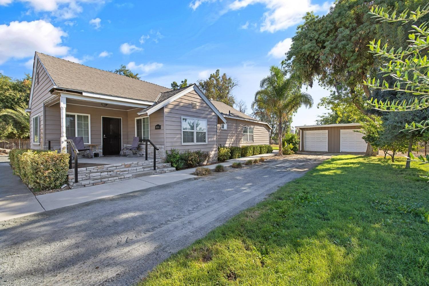 front view of a house with a garden