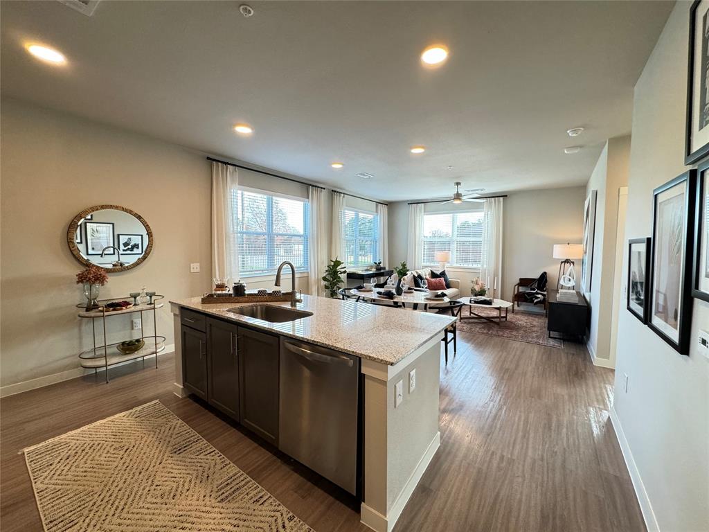 a large kitchen with stainless steel appliances lots of counter top space