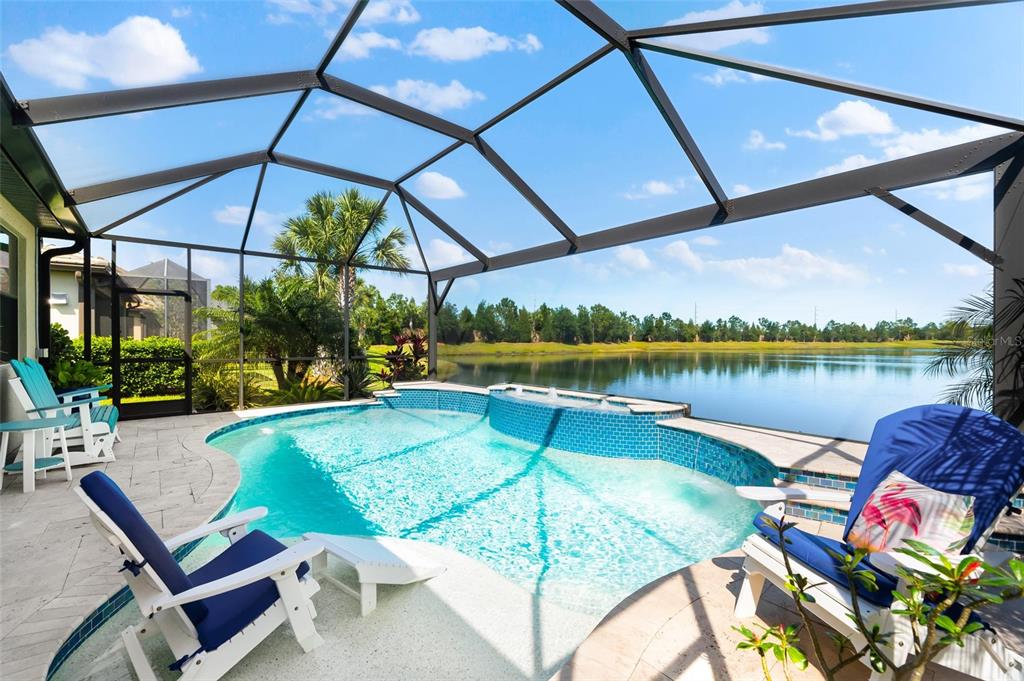 a view of a swimming pool with a lounge chairs