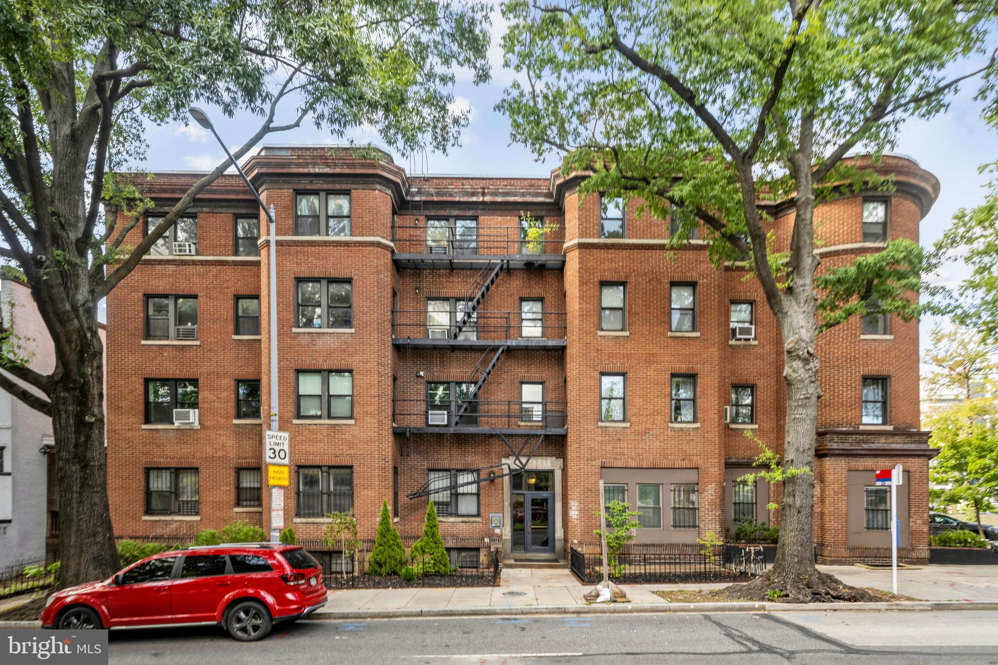 a red building in front of a building