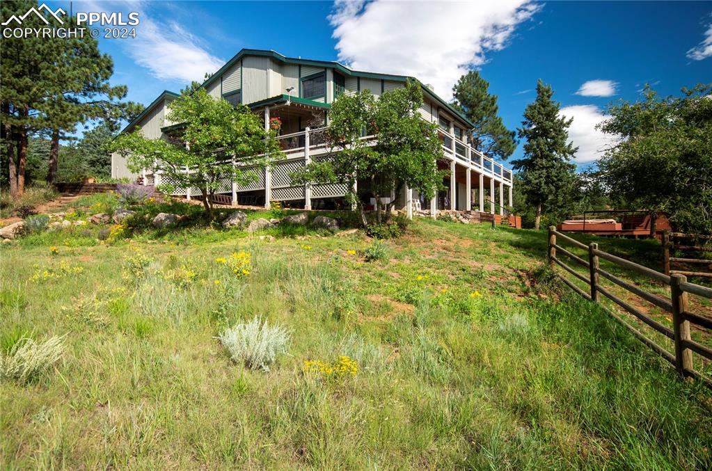 a backyard of a house with lots of green space