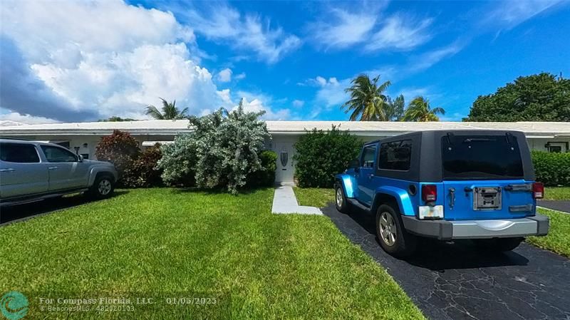 a view of house with swimming pool outdoor seating