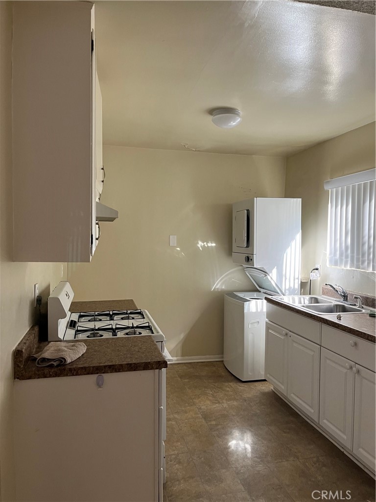 a kitchen that has a sink and a stove