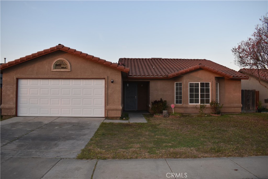 a front view of a house with a garage