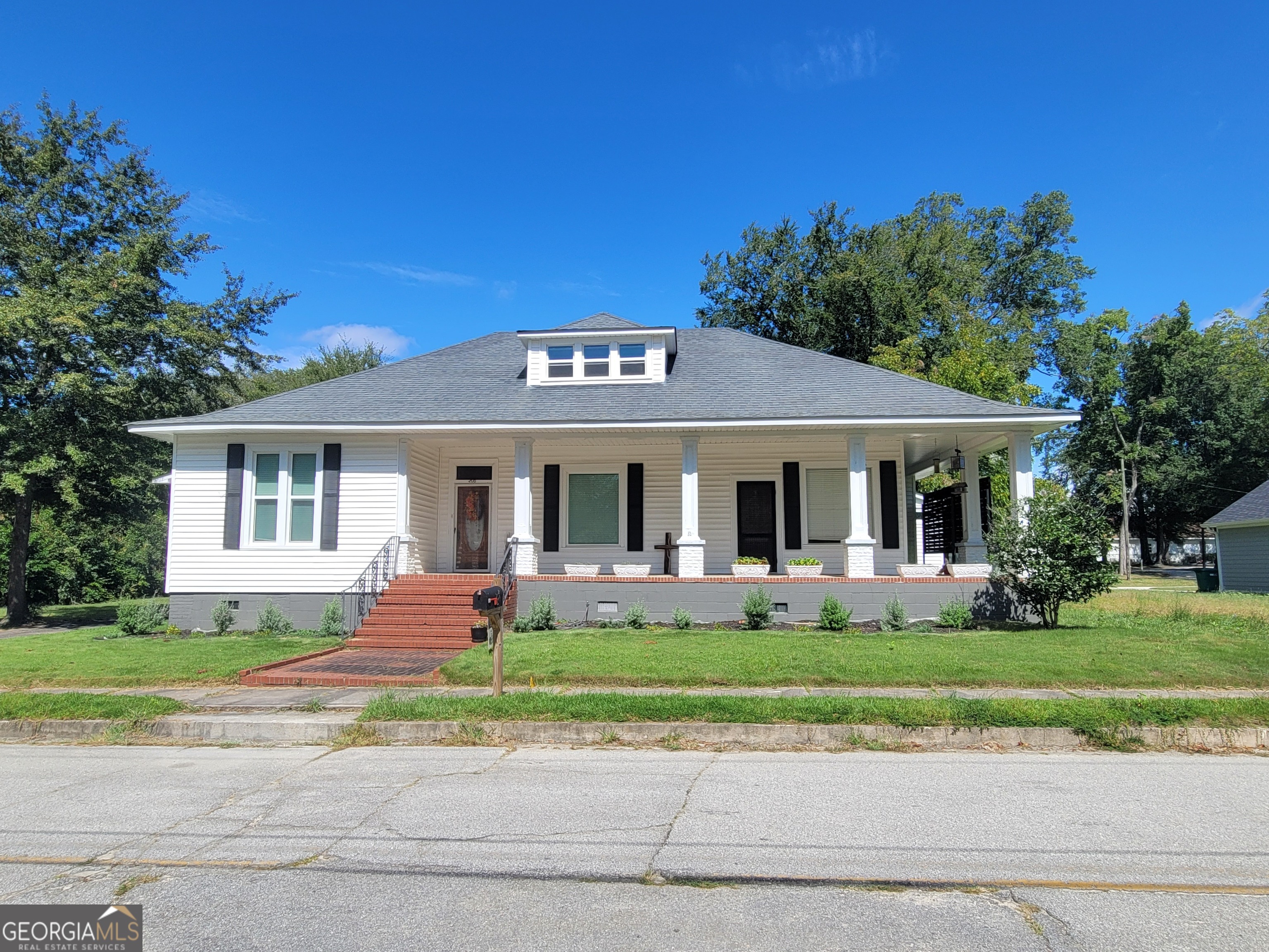 front view of a house with a yard