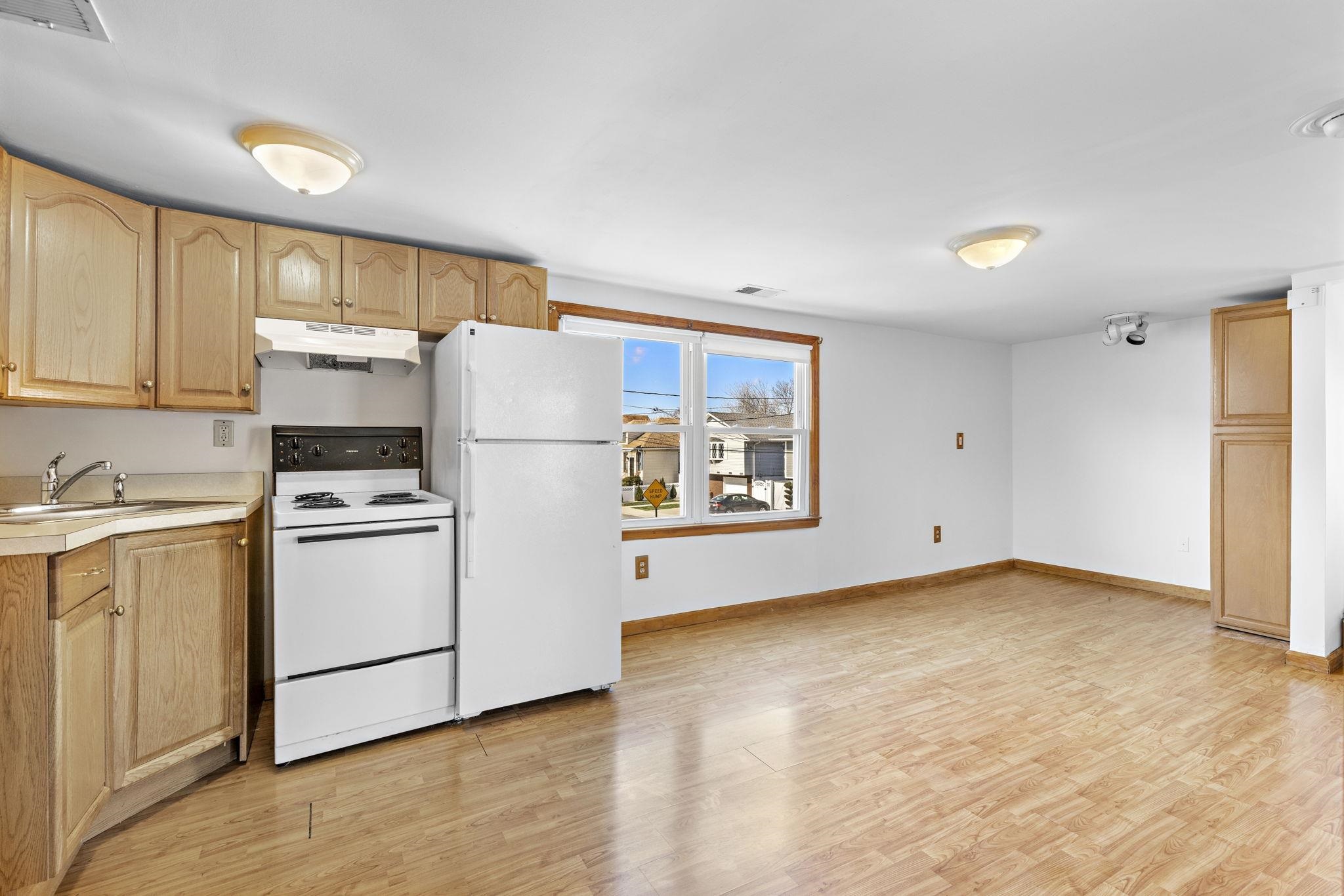 a kitchen with a cabinets and white appliances