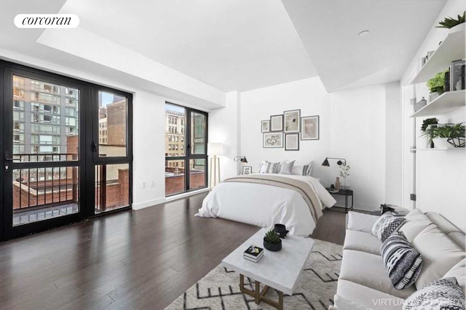 a spacious bedroom with a bed and wooden floor