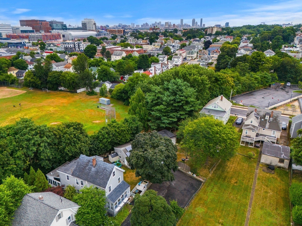 an aerial view of residential houses with outdoor space