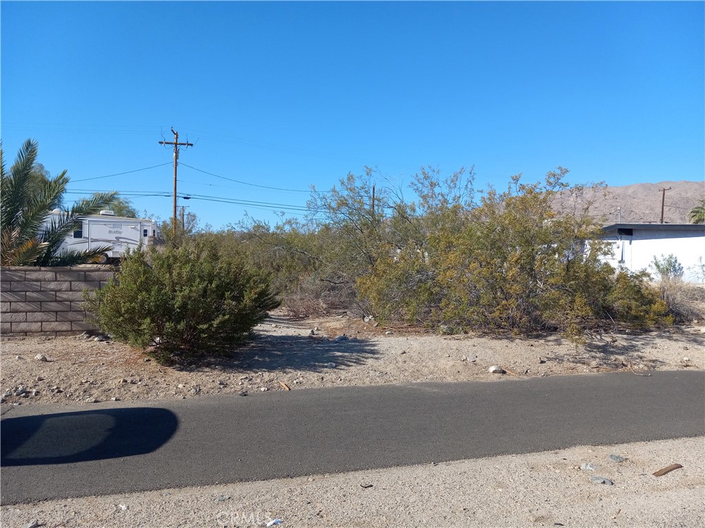 a view of a road with a building in the background