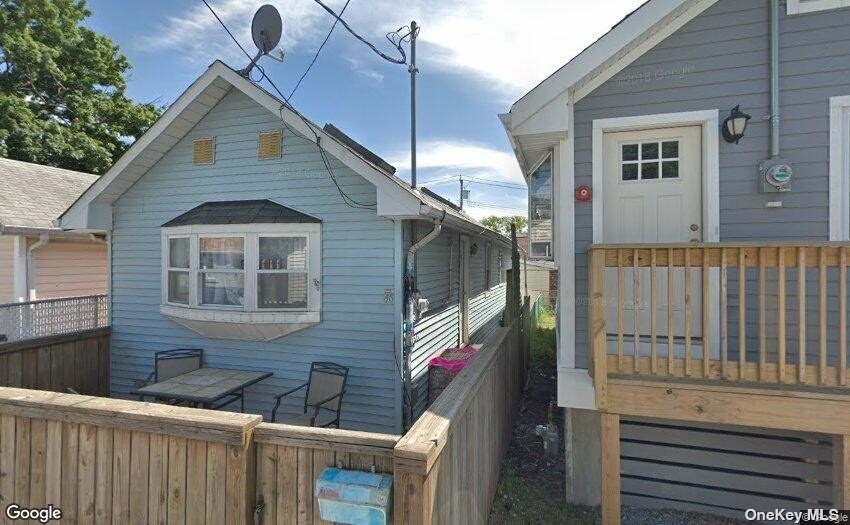 a house view with a backyard space