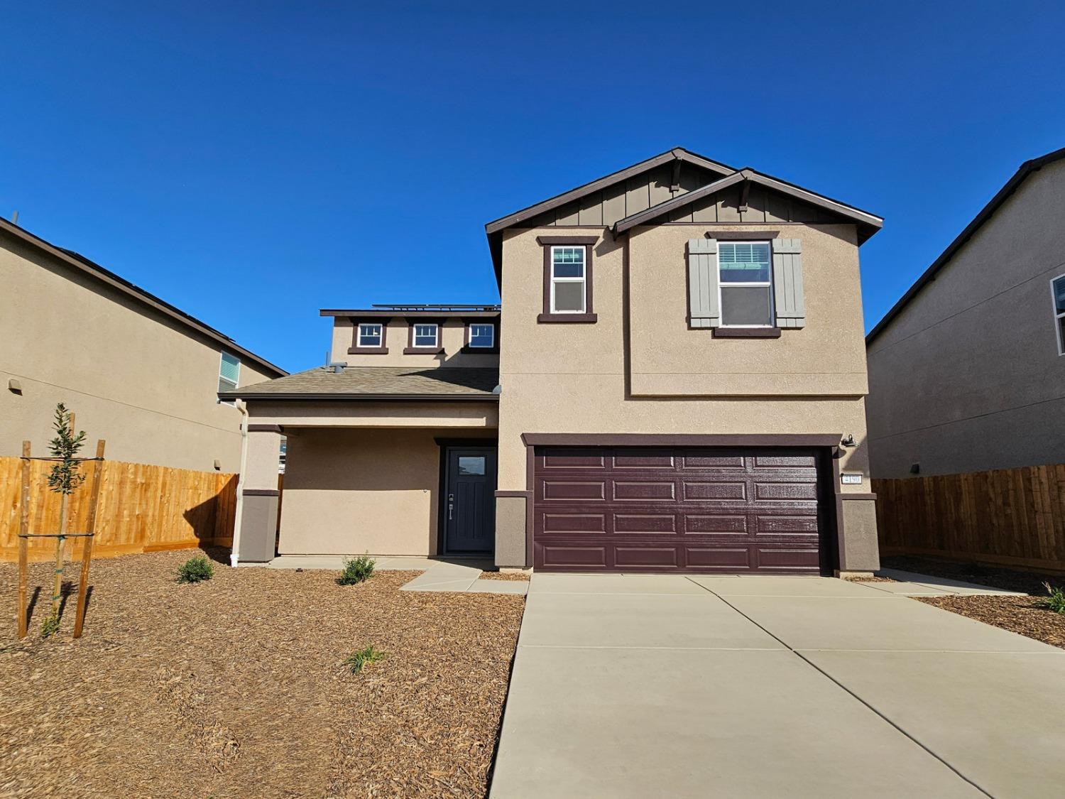 a front view of a house with a garage