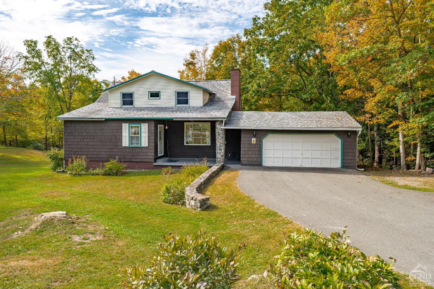 a front view of a house with a yard