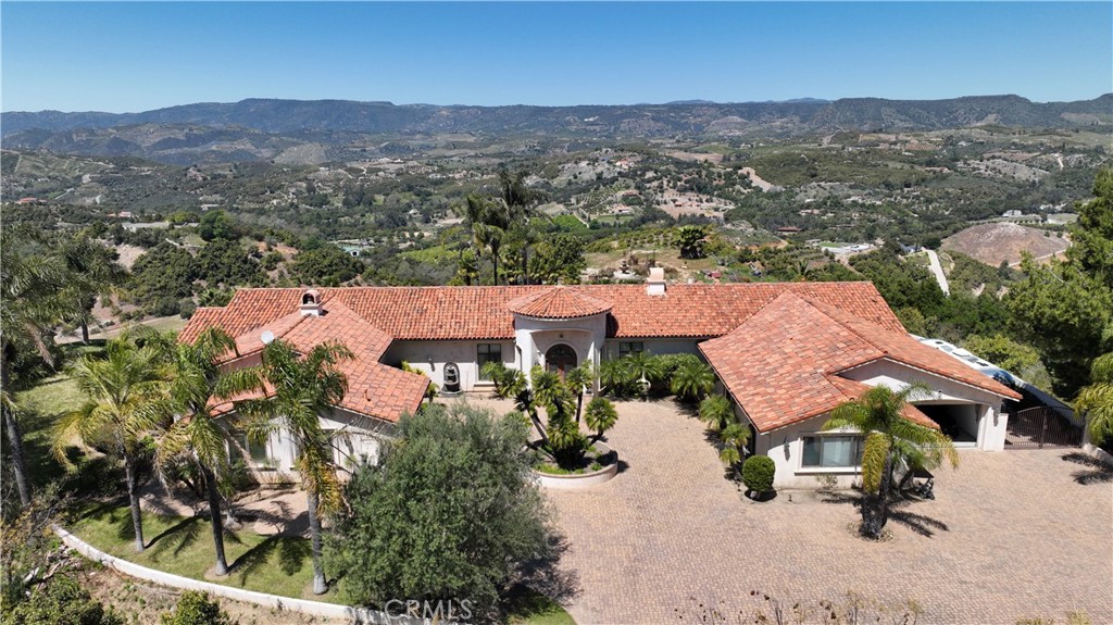 an aerial view of residential houses and wooden fence