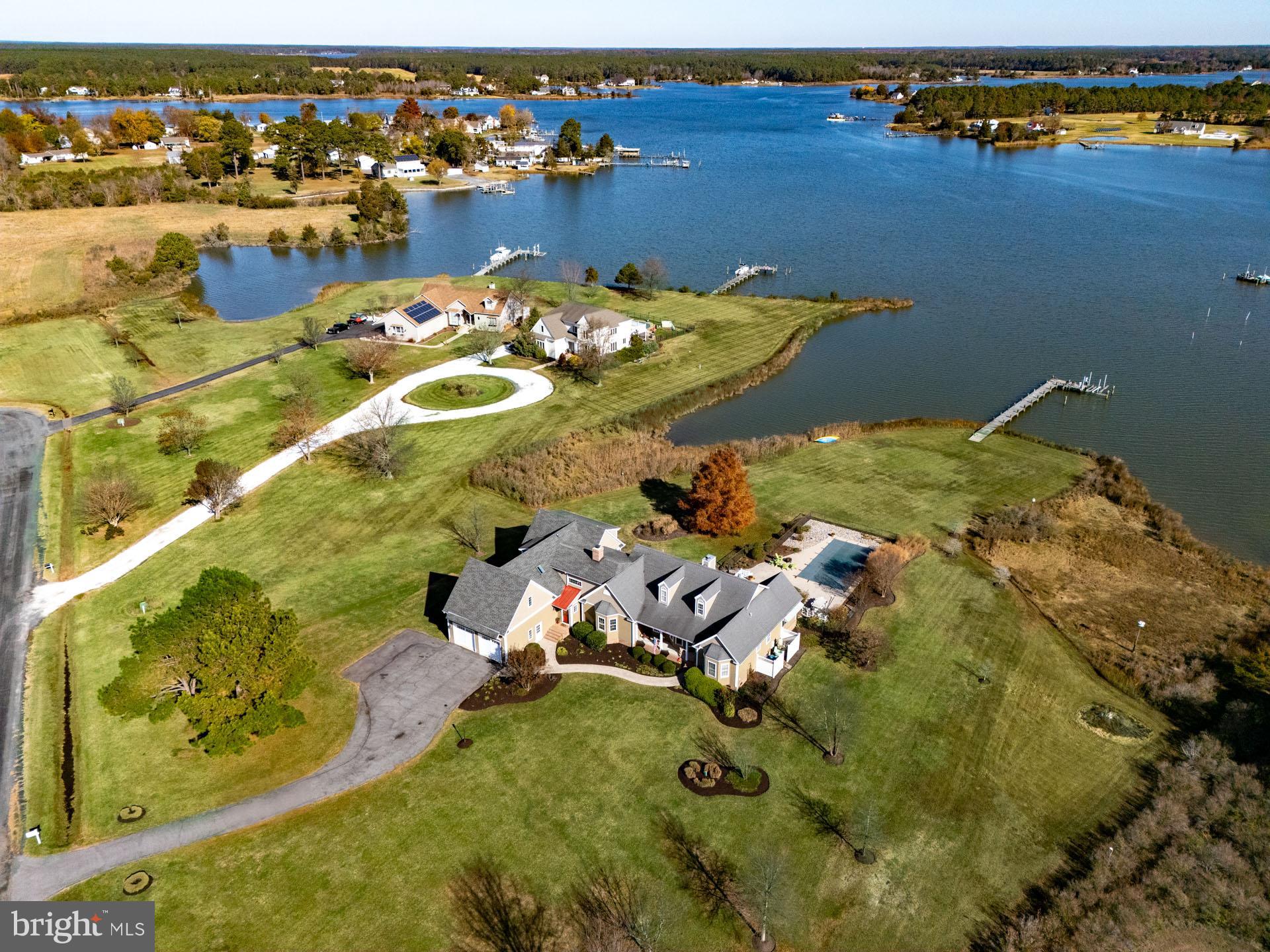 an aerial view of a house with a ocean view