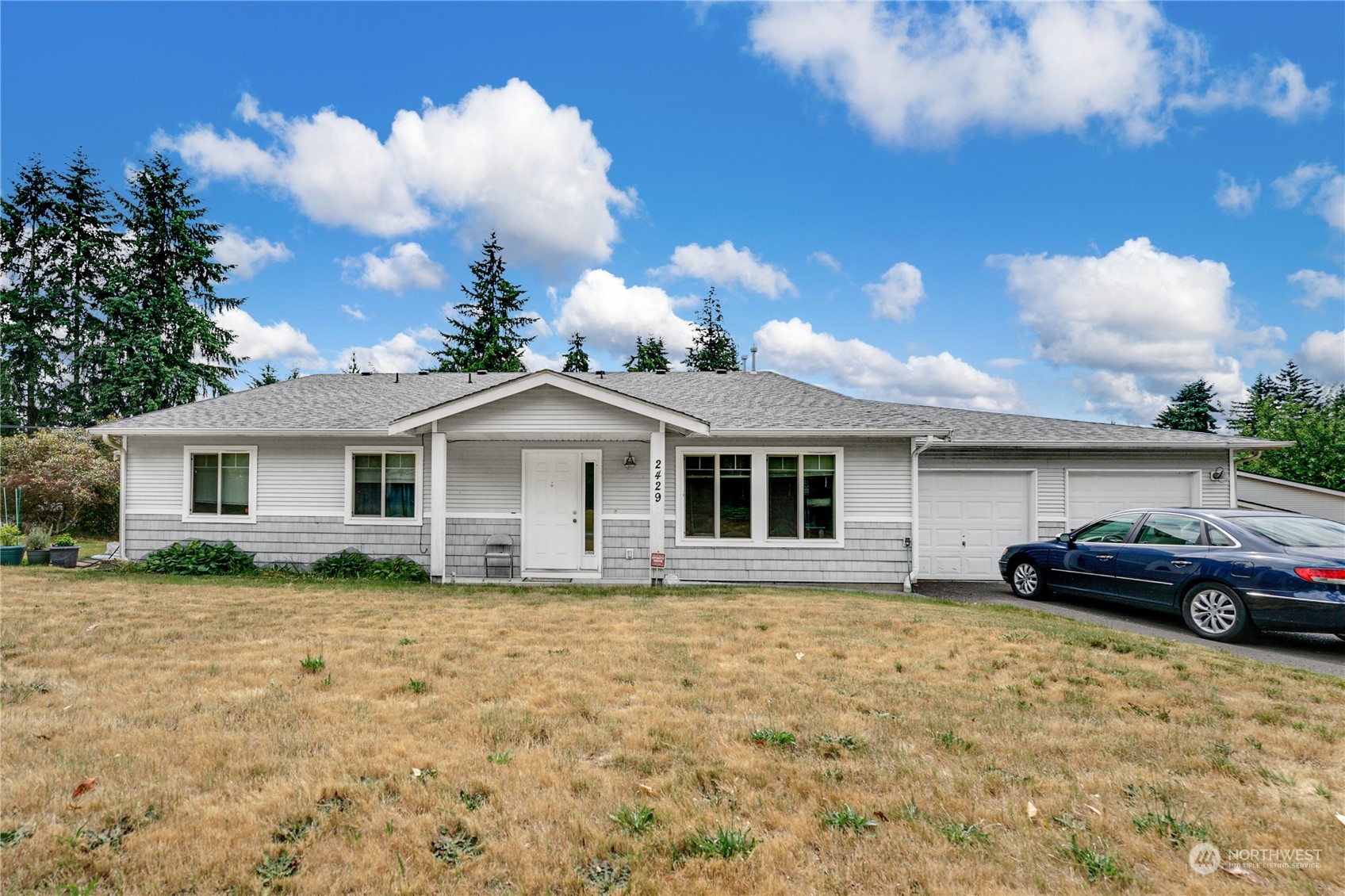 a front view of a house with a yard