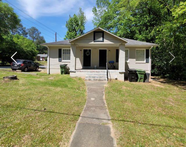 a house with yard in front of it