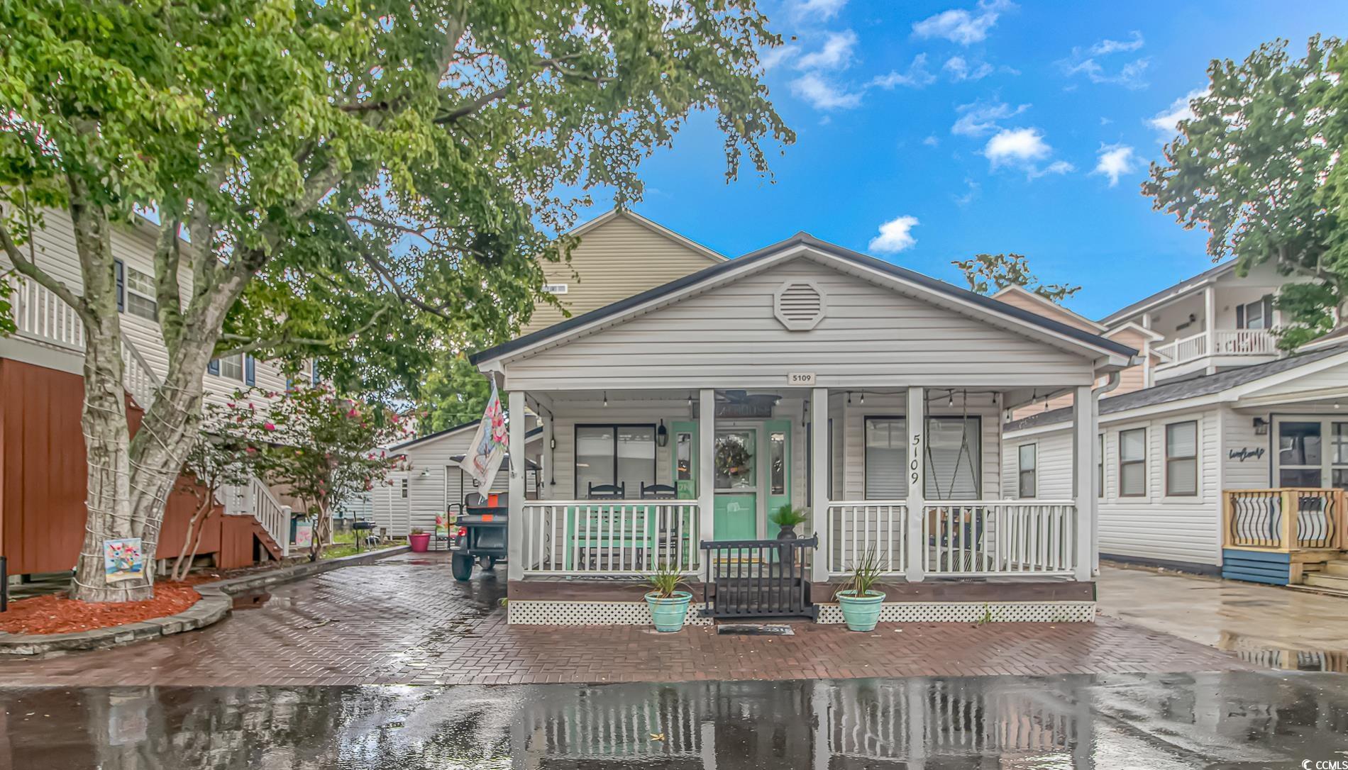 View of front of property with covered porch