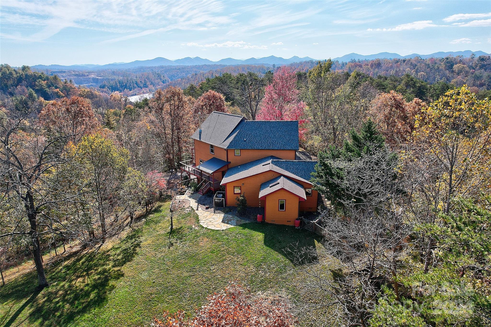 an aerial view of a house with an outdoor space