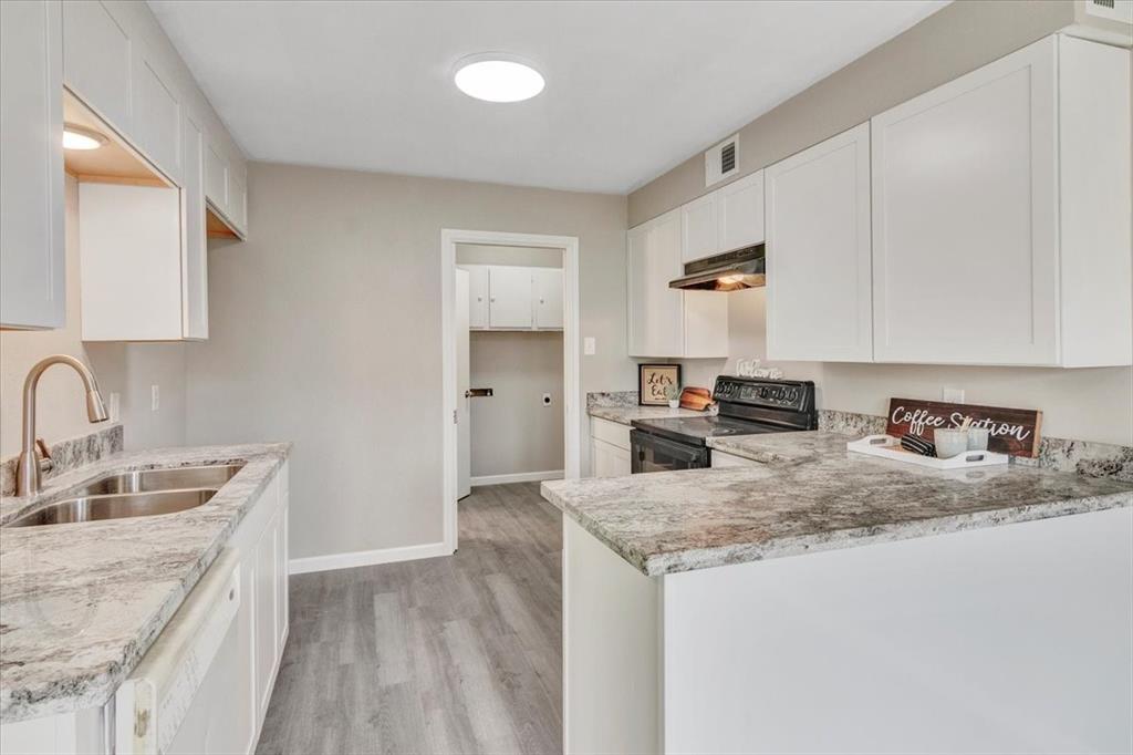 Kitchen has been remodeled with new cabinets, quartz countertops, and florring.