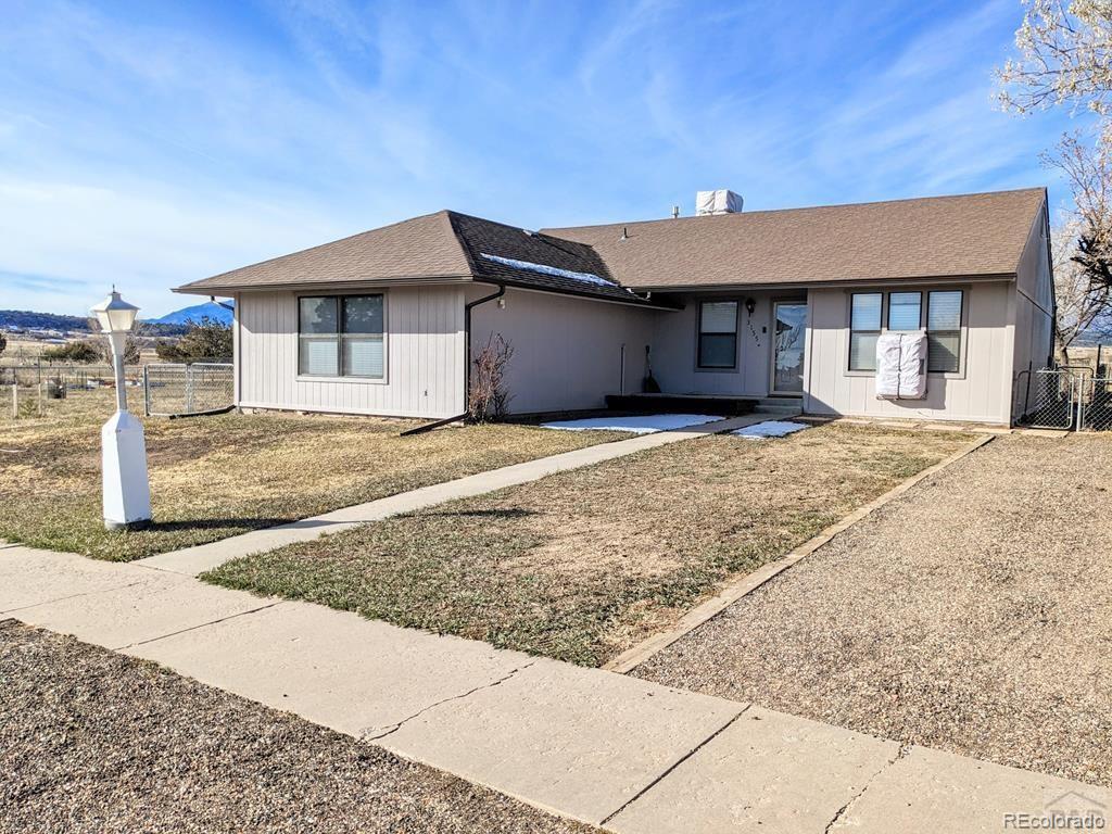 a house with yard in front of it