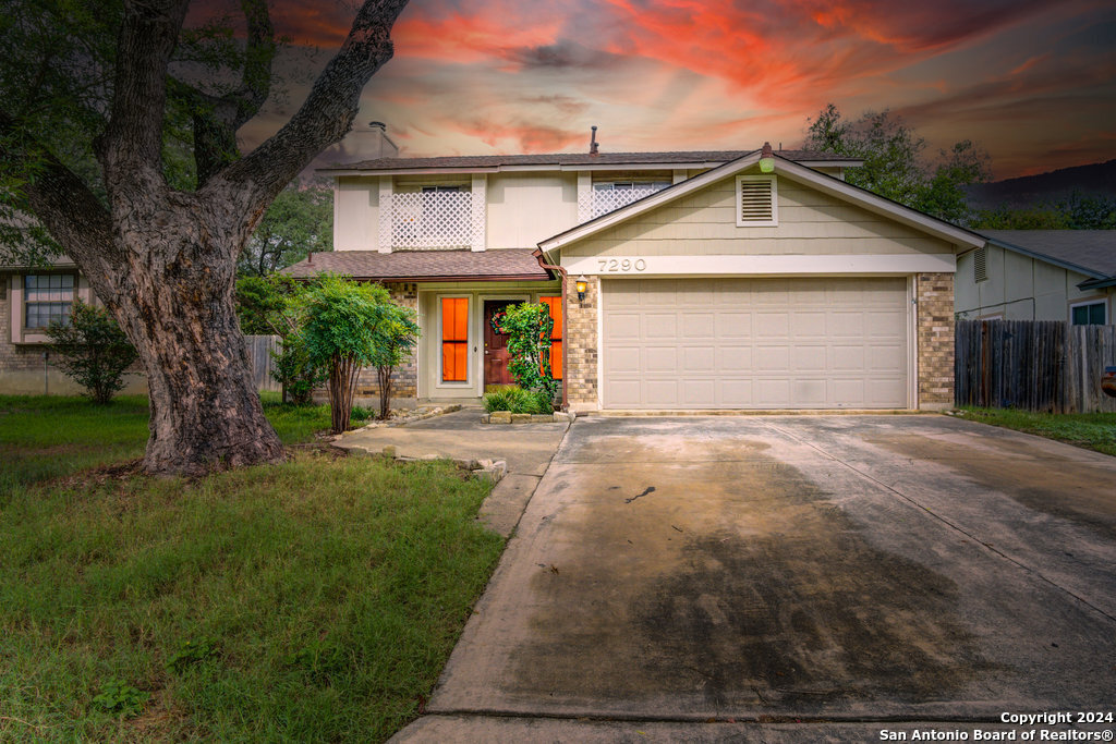 a view of a house with a yard