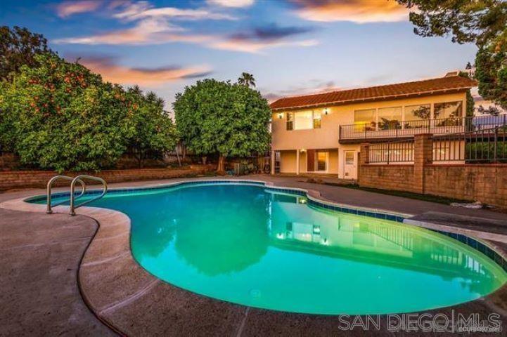 an aerial view of a house with swimming pool