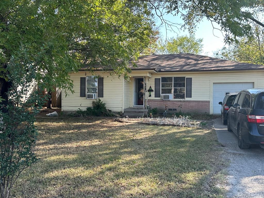 a front view of a house with a yard and porch