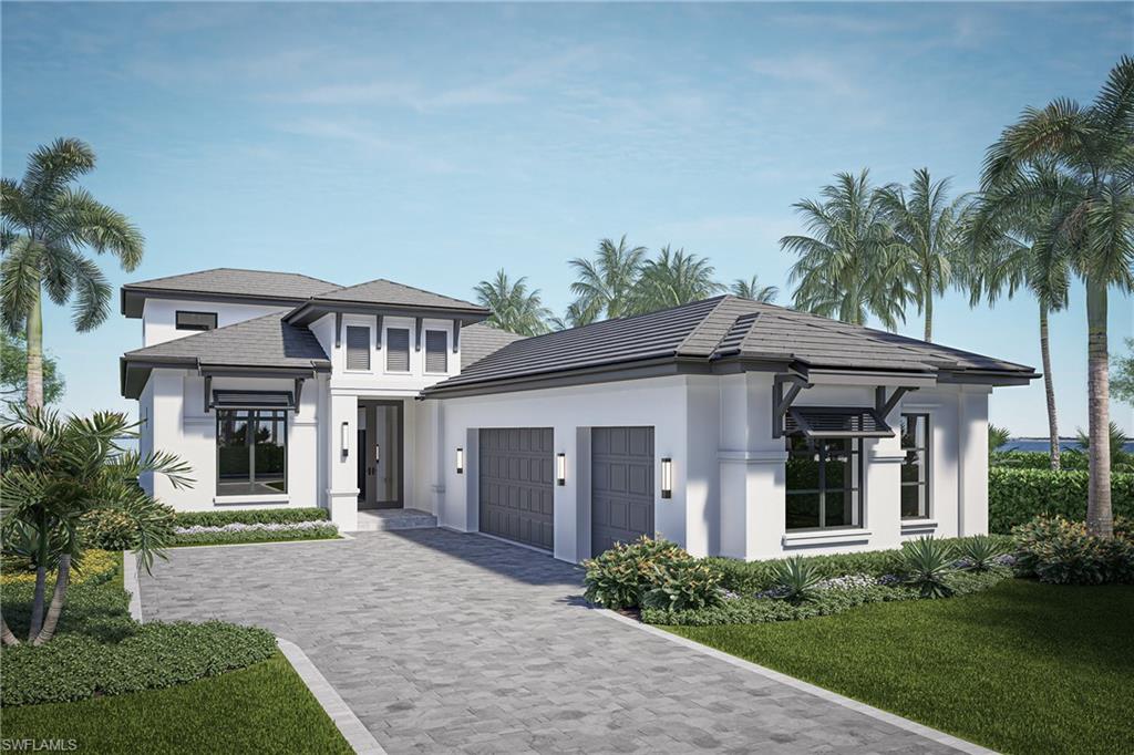 View of front of home with a front lawn and a garage