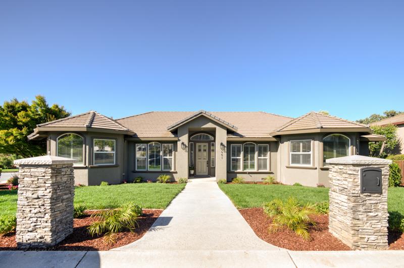 a front view of a house with yard