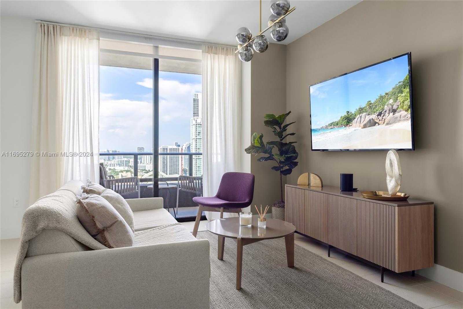 a living room with furniture ceiling fan and a window