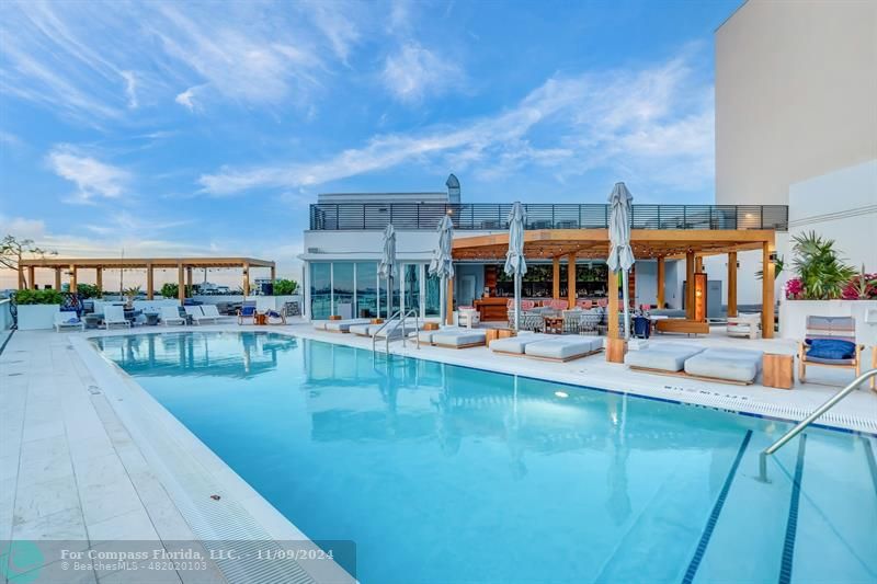 a view of a swimming pool with a patio