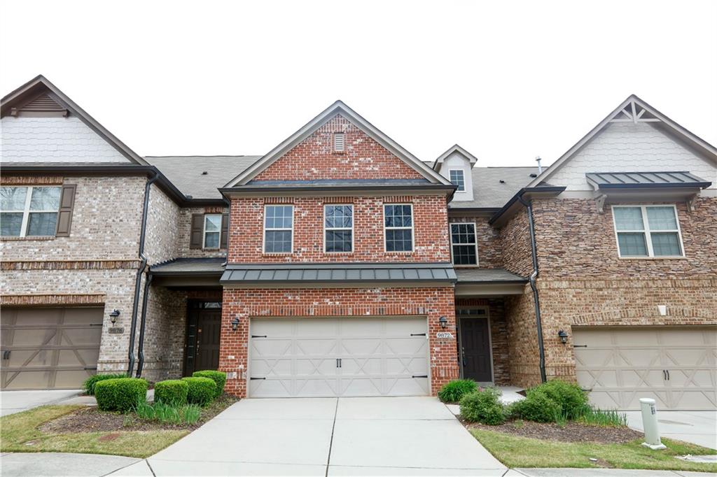 a front view of a house with garage