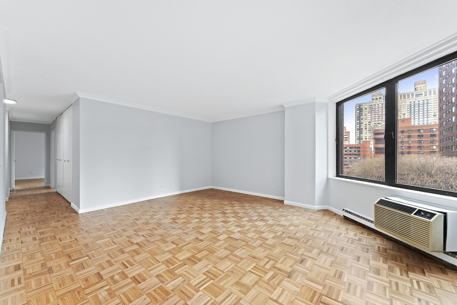 a view of an empty room with a window